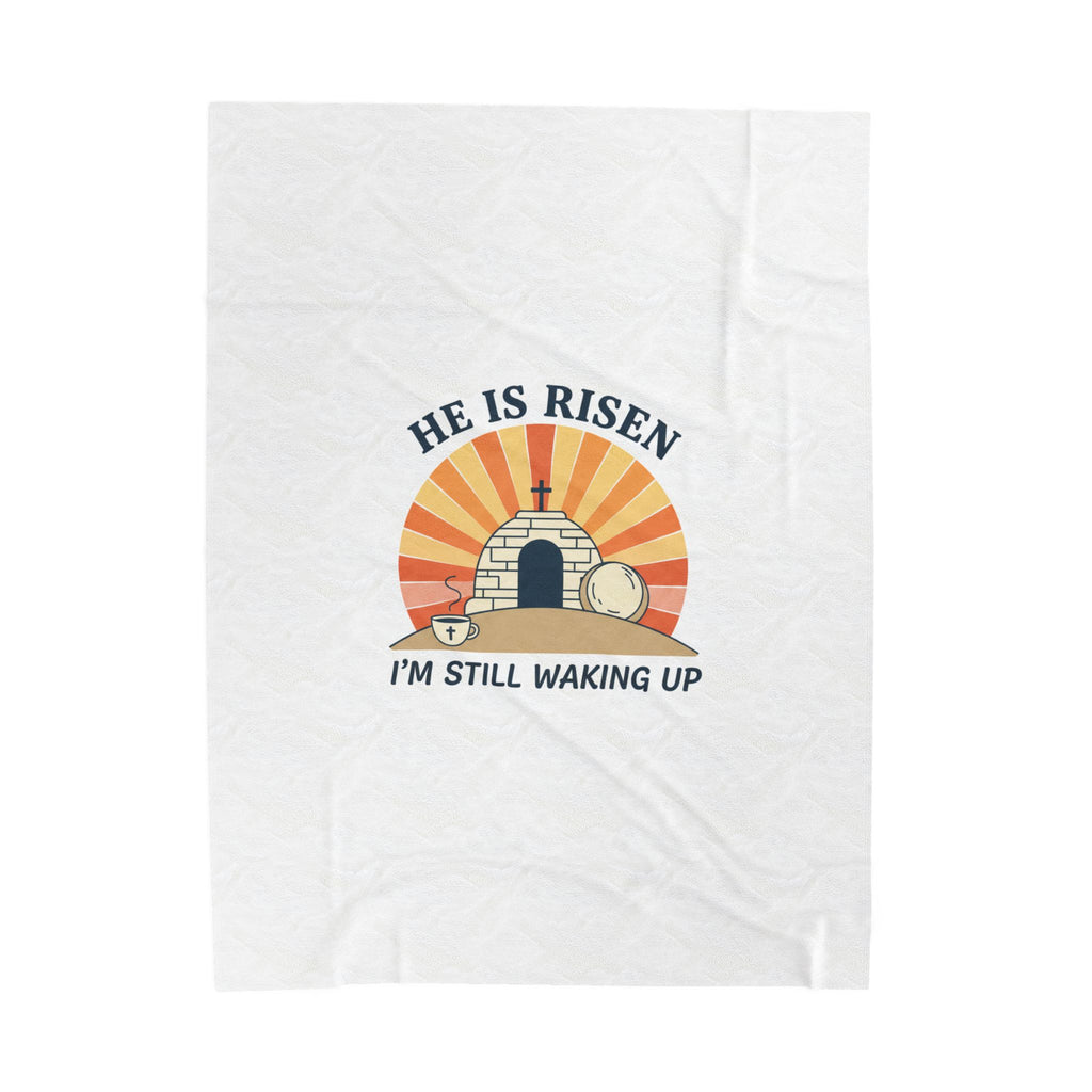 White towel with 'He is Risen, I'm Still Waking Up' graphic design on a white background