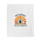 White t-shirt with 'He is Risen, I'm Still Waking Up' graphic design on a white background