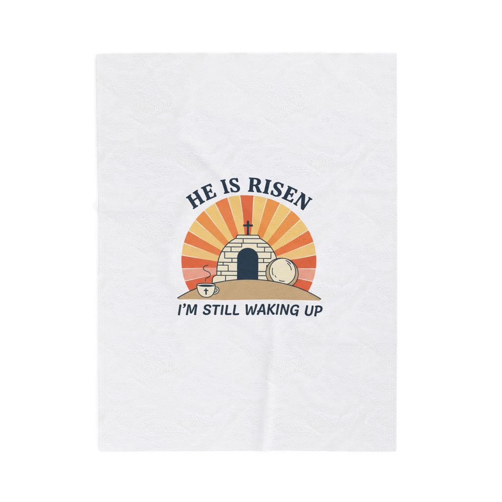 White towel with 'He is Risen, I'm Still Waking Up' design featuring a tomb and cross.