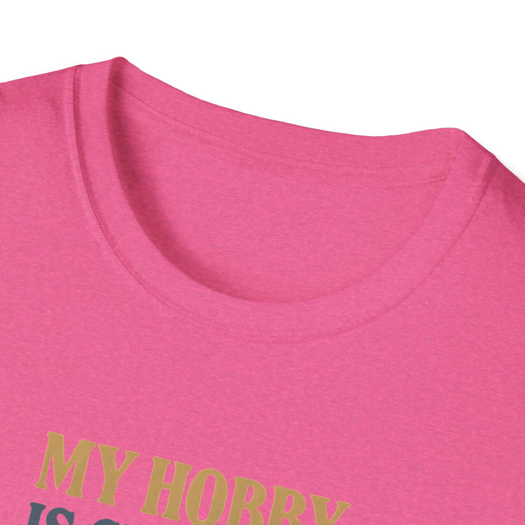 Close-up of a pink shirt with text in green on a white background